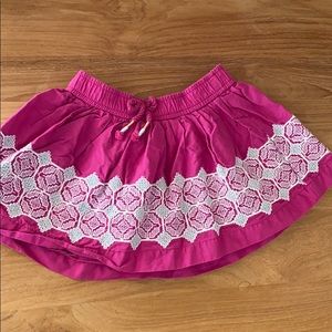 Cute pink embroidered boho skirt with tassel trim
